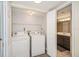 Laundry room with washer and dryer near bathroom at 150 Waterfall Way # 102, Altamonte Springs, FL 32714