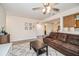 Bright and airy living room featuring a comfortable sectional sofa and modern decor at 150 Waterfall Way # 102, Altamonte Springs, FL 32714