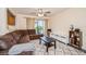 Comfortable living room with ceiling fan, area rug, and a view to the screened in porch at 150 Waterfall Way # 102, Altamonte Springs, FL 32714
