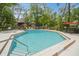 Community pool with lounge chairs and tables at 150 Waterfall Way # 102, Altamonte Springs, FL 32714