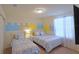 Charming bedroom with two twin beds, decorative castle-themed wall art, and window with sheer curtains at 1663 Lima Ave, Kissimmee, FL 34747