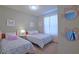 Charming bedroom features two twin beds with butterfly accents and whimsical decor at 1663 Lima Ave, Kissimmee, FL 34747