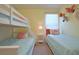 Bright ' bedroom with bunk beds, a twin bed, and playful flamingo and animal wall decorations at 1663 Lima Ave, Kissimmee, FL 34747