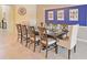 Formal dining room features a table set for ten under modern decor at 1663 Lima Ave, Kissimmee, FL 34747