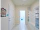 Mud room entryway features a welcome sign, storage shelves, and hooks for coats and accessories at 1663 Lima Ave, Kissimmee, FL 34747