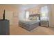 Relaxing bedroom featuring a king-size bed with swan towel art, soft lighting, and neutral decor at 1663 Lima Ave, Kissimmee, FL 34747
