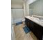 Bathroom featuring tiled floors, a double vanity, and bathtub with shower at 1800 Post Oak Dr, Davenport, FL 33837