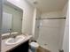Clean bathroom with a walk-in shower, modern fixtures, and a neutral color palette at 1800 Post Oak Dr, Davenport, FL 33837