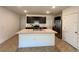 Modern kitchen with stainless steel appliances and center island at 1800 Post Oak Dr, Davenport, FL 33837
