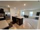 Spacious kitchen with stainless steel appliances, center island, and adjacent dining area at 1800 Post Oak Dr, Davenport, FL 33837