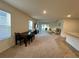 Bright living room area that connects to the dining room and kitchen at 1800 Post Oak Dr, Davenport, FL 33837