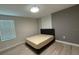 Bright bedroom with vinyl floors, a modern ceiling fan, and a cozy bed at 18219 Oliver Twist Way, Winter Garden, FL 34787