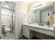 Well-lit bathroom featuring vanity and a shower, decorated with bright accessories at 200 Maitland Ave # 224, Altamonte Springs, FL 32701