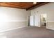 Bright bedroom with a wood ceiling, neutral walls and carpeted floors. Two doorways lead to more rooms at 200 Maitland Ave # 224, Altamonte Springs, FL 32701