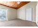 Bright bedroom featuring a vaulted wood ceiling, neutral carpet, and double closets at 200 Maitland Ave # 224, Altamonte Springs, FL 32701