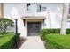 Inviting condo exterior featuring neatly manicured hedges and neutral tones at 200 Maitland Ave # 224, Altamonte Springs, FL 32701