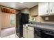 A practical kitchen with lots of storage, view to the living room, and modern appliances at 200 Maitland Ave # 224, Altamonte Springs, FL 32701