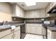 A compact kitchen featuring sleek countertops, lots of storage, and practical appliances at 200 Maitland Ave # 224, Altamonte Springs, FL 32701
