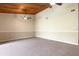 Open living room with carpeted flooring and a wood-paneled ceiling, offering a cozy and inviting atmosphere at 200 Maitland Ave # 224, Altamonte Springs, FL 32701