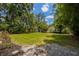 Expansive backyard featuring lush lawn and storage shed, perfect for outdoor activities at 2020 Palmer St, Orlando, FL 32803