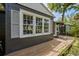 Exterior of home featuring multi-paned windows, crisp shutters and natural wood porch at 2020 Palmer St, Orlando, FL 32803