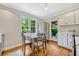 Charming eat-in kitchen with hardwood floors, stainless steel appliances and lots of natural light at 2020 Palmer St, Orlando, FL 32803