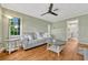 Light filled living room boasting hardwood floors, a ceiling fan and neutral toned walls at 2020 Palmer St, Orlando, FL 32803