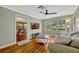 Cozy living room showcasing hardwood floors, neutral colors and views into the sunroom at 2020 Palmer St, Orlando, FL 32803