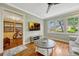 Living room featuring hardwood floors, neutral colors, and views into the sunroom at 2020 Palmer St, Orlando, FL 32803