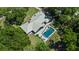 Stunning aerial view of home with a private pool and large backyard space at 203 E Greentree Ln, Lake Mary, FL 32746
