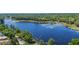 Beautiful lake view surrounded by lush greenery and mature trees at 203 E Greentree Ln, Lake Mary, FL 32746