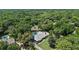 Expansive wooded property featuring a pool and tennis court at 203 E Greentree Ln, Lake Mary, FL 32746