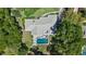 Aerial shot of this beautiful home with a private backyard pool, perfect for relaxation at 203 E Greentree Ln, Lake Mary, FL 32746