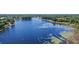 Expansive lake view surrounded by lush greenery and mature trees at 203 E Greentree Ln, Lake Mary, FL 32746
