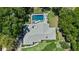 Bird's eye view of home with a pool, well-manicured lawn, and mature landscaping at 203 E Greentree Ln, Lake Mary, FL 32746