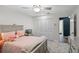 Cozy bedroom with neutral carpet, ceiling fan, view to closet and connecting room at 203 E Greentree Ln, Lake Mary, FL 32746