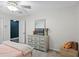 Bedroom with ceiling fan, wall mirror, plush carpet and warm paint is move in ready! at 203 E Greentree Ln, Lake Mary, FL 32746