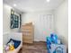 Bright, bedroom with a fun play area, closet, and wood-look floors provides lots of charm at 203 E Greentree Ln, Lake Mary, FL 32746