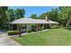 Beautifully landscaped property with mature trees and manicured lawn at 203 E Greentree Ln, Lake Mary, FL 32746