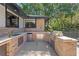 Outdoor kitchen featuring a built-in grill and stainless steel storage at 203 E Greentree Ln, Lake Mary, FL 32746