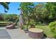 Patio seating area with comfortable wicker furniture and a large umbrella at 203 E Greentree Ln, Lake Mary, FL 32746