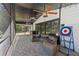 Spacious screened patio with stone flooring, ceiling fans, and outdoor seating is perfect for entertaining at 203 E Greentree Ln, Lake Mary, FL 32746