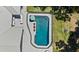 Aerial view of the private swimming pool with fenced surround and patio at 203 E Greentree Ln, Lake Mary, FL 32746