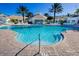 Large community pool with tanning deck, steps, and luxurious lounge seating at 2302 Butterfly Palm Way # 105, Kissimmee, FL 34747