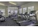 Well-equipped fitness center with treadmills, elliptical, and weight machines for resident use at 2302 Butterfly Palm Way # 105, Kissimmee, FL 34747