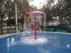 Community splash pad featuring a fun umbrella fountain and spraying water features at 2302 Butterfly Palm Way # 105, Kissimmee, FL 34747