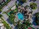 Aerial view of a resort-style community pool, basketball and tennis courts at 2302 Silver Palm Dr # 203, Kissimmee, FL 34747