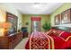 Bedroom with bright walls, large dresser and window for natural light at 2302 Silver Palm Dr # 203, Kissimmee, FL 34747
