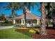 Beautiful clubhouse exterior with manicured landscaping, offering an inviting space for community gatherings and events at 2302 Silver Palm Dr # 203, Kissimmee, FL 34747