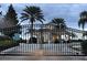 A secure gated entrance to the community with lush landscaping and elegant architecture, enhancing privacy and security at 2302 Silver Palm Dr # 203, Kissimmee, FL 34747